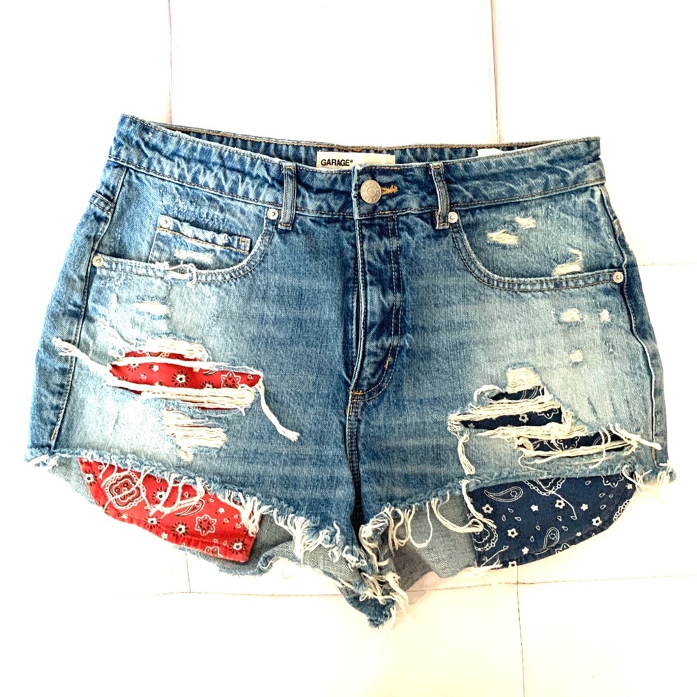 blue distressed denim shorts with pattern pockets